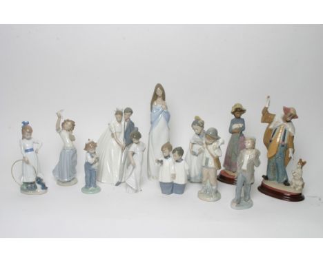 A collection of twelve Nao figures including a bride and groom and clown