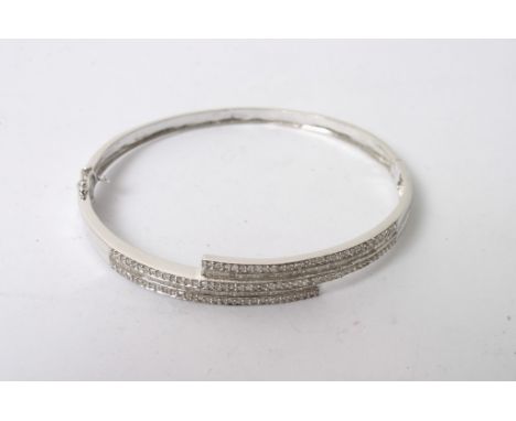 A ladies 18ct white gold bangle set with approximately 1.5ct of diamonds