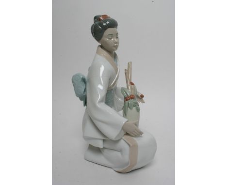 A large Nao figure of an oriental figure 
