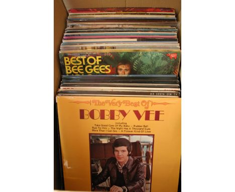 A box containing a collection of LP records including; The Beatles, Elvis Presley, Bobby Vee, The Animals, Rod Stewart, Barry