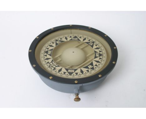 A large ship's compass, approximately 30cm diameter