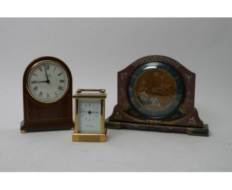 A collection of three clocks comprising a mahogany mantle clock in the Edwardian style, a chinoiserie style mantle clock and 