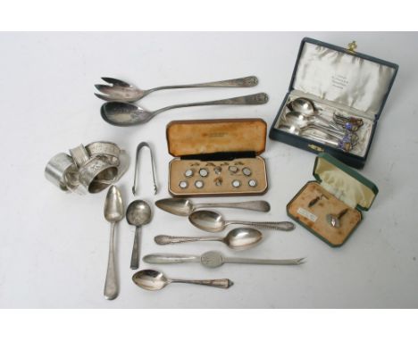 A collection of silver and plated war including spoons, napkin rings, cufflinks, a cased set of enamel spoons