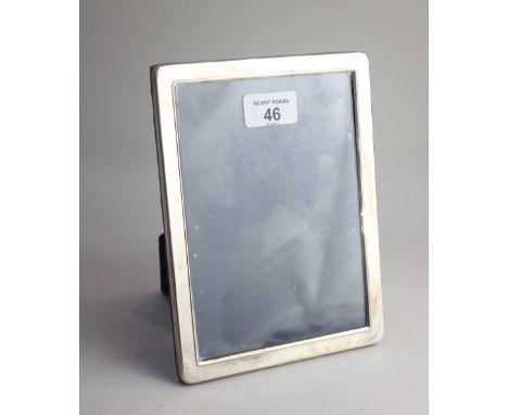 A modern silver mounted rectangular photograph frame on easel stand 20cm hiigh