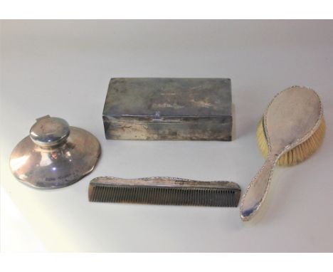 A George VI silver cigarette box, George V silver capstan inkwell, both with engraved inscriptions, silver backed dressing ta