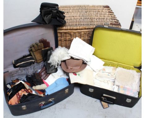 Two vintage suitcases, one containing a quantity of vintage linen and lace, mainly tableware, the other containing gentlemen'