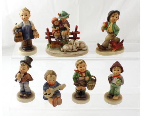 Seven Hummel figures to include a young boy cobbler, a girl playing the lute and a figural group of young couple on bench wit