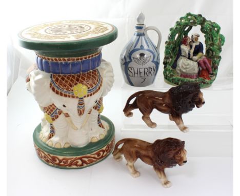 An Oriental ceramic stool with elephant base and abstract decoration, a pair of ceramic lions, a Staffordshire flat-back of c