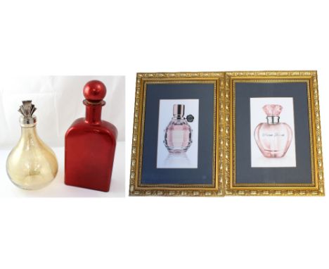 Two large decorative glass perfume bottles; one large ovoid example with white metal Art Deco top and a large red flask-shape