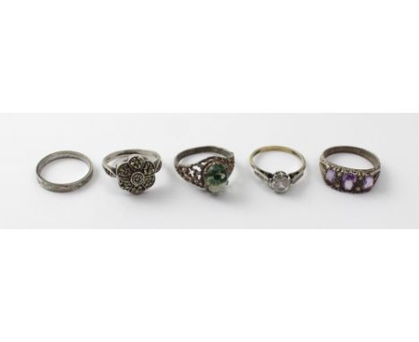 A group of five silver dress rings set with stones to include cabochon moss agate style stone, one with three amethyst colour