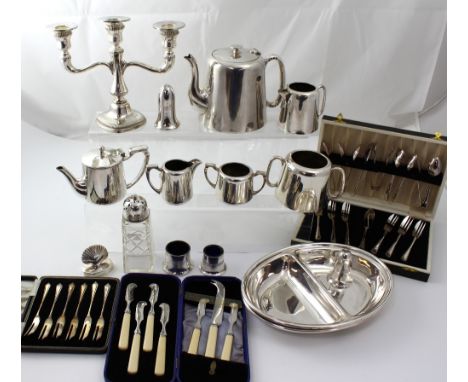 A quantity of plated ware to include a cased set of cheese knifes, candelabra, glass sugar caster, chafing dishes etc.