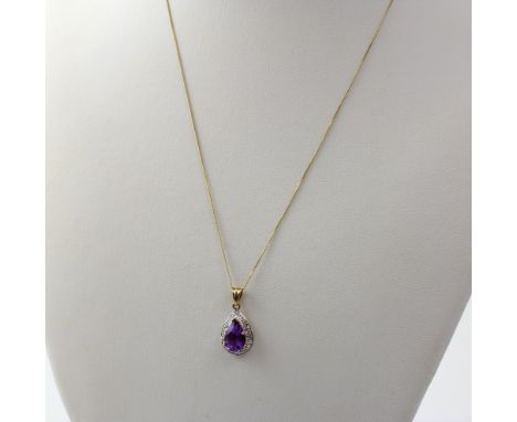 A 9ct yellow and white gold pendant with amethyst-coloured pear-shaped tone, on a fine 9ct gold link chain, approx 1.7g.