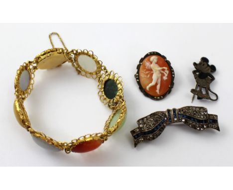 A yellow metal mounted semi-precious stone bracelet, a marcasite-mounted silver shell cameo brooch, a silver and paste-set bo