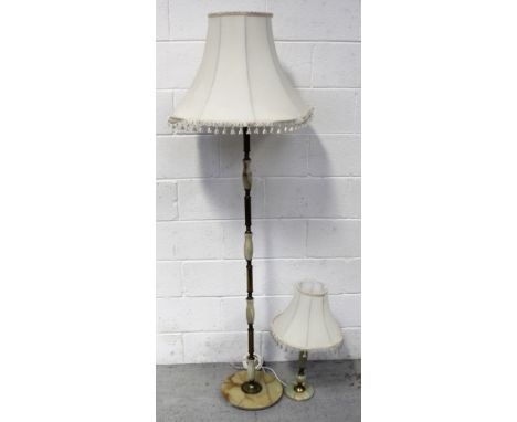 An onyx and brass standard lamp, on circular base, height 134cm and a non-matching green onyx and brass column table lamp, he