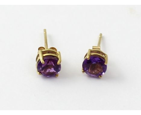 A pair of 9ct gold amethyst stud earrings.