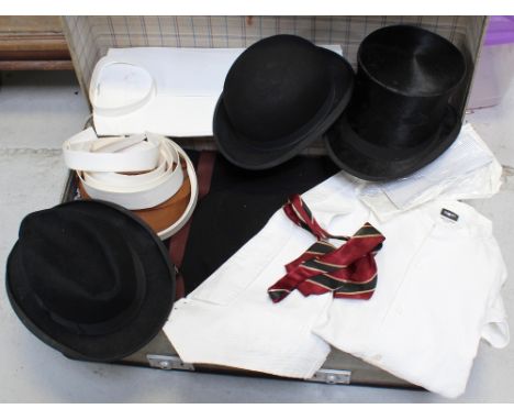 A vintage suitcase initialled 'L.V.G' with a quantity of gentlemen's Edwardian clothing to include white dress shirts, a whit