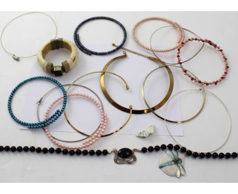 A boxed Isle of Bute collection ivory-style bangle, silver chokers, various coloured pearl chokers, a yellow metal choker, a 