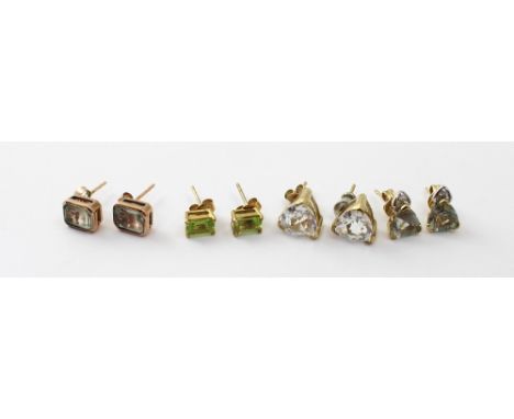 Four pairs of 9ct gold stud earrings to include a 'Glacier Topaz' set pair, green amethyst pair, peridot pair and green ameth