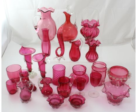 Approximately twenty pieces of Victorian and later cranberry glassware to include a decanter, trumpet vases, bowls, small vas