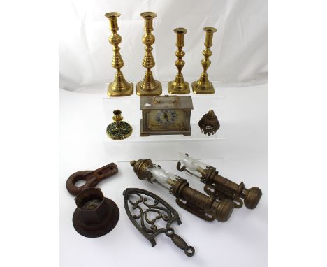 A pair of brass carriage lamps marked 'GER' (one af), two pairs of brass candlesticks, an iron trivet, a candlestick with mos