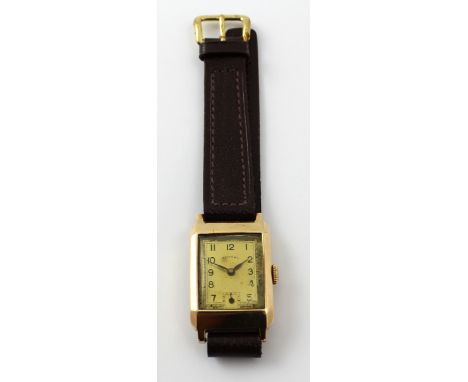 Rotary; a 9ct gold tank watch with Arabic numerals and subsidiary seconds dial, marked '375' to the case, on later leather st