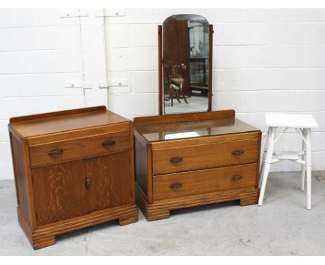 A retro oak mirror-back dressing table, two drawers to bracket supports, length 90cm, a matching Art Deco style oak cabinet, 