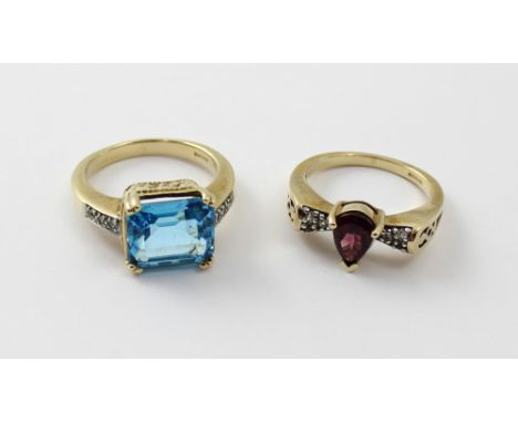 A 9ct gold 'Swiss Blue' and white topaz ladies' dress ring, size N and a 9ct gold and amethyst ladies' dress ring, size M 1/2