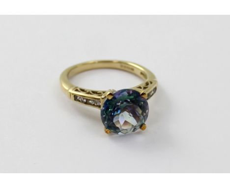 A 9ct gold 'Neptune' and white topaz ladies' dress ring, size M 1/2, approx 3.9g, with certificate.