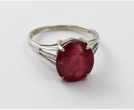 An 18ct white gold ladies' dress ring set with a 'Royal' ruby, size N, approx 4g, with certificate.