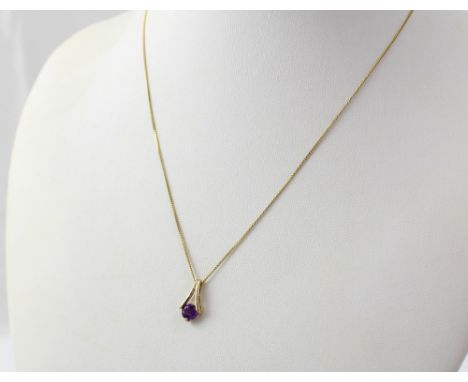 A 9ct gold chain with amethyst coloured stone, approx 1.3g.