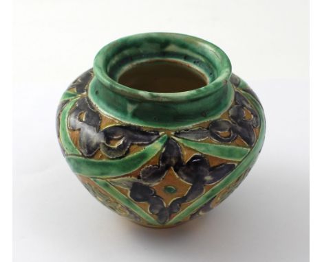 A Della Robbia small green ground baluster vase, hand-painted with abstract flora, maker's marks to the base, height 7.5cm.