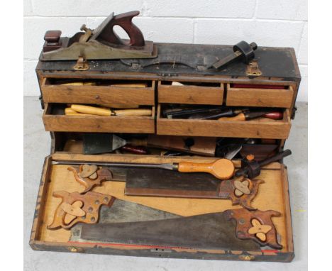 A vintage cabinet maker's toolbox, length 82cm, containing a quantity of vintage tools to include saws, planes, chisels etc. 