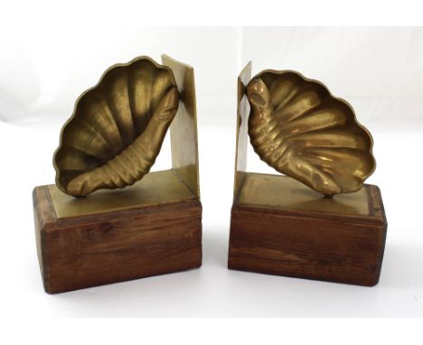 A pair of vintage wooden and brass bookends in the form of shells (2).