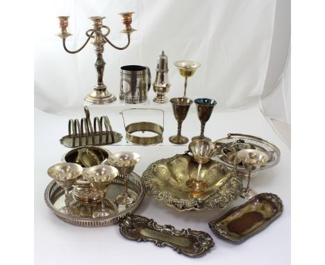 A quantity of silver-plated items to include a swing-handled basket, candelabra, a table lamp etc.