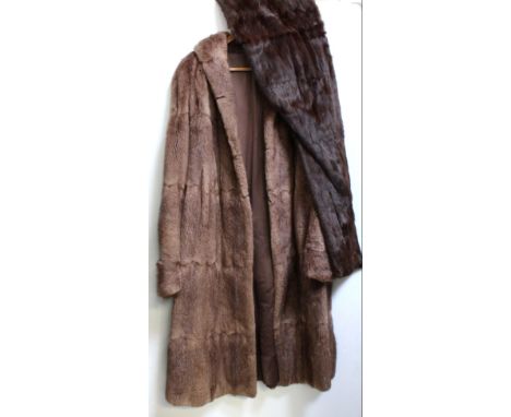 A vintage c1950s musquash ladies' full length fur coat, and a c1950s fur evening wrap (2).