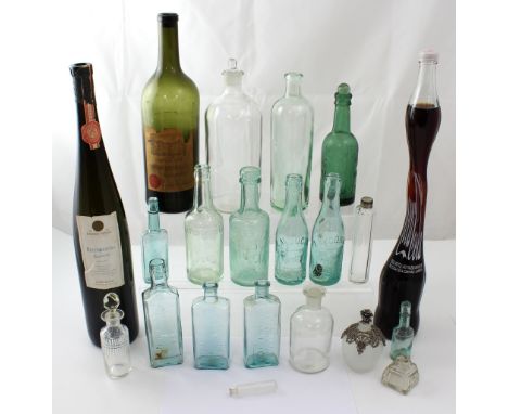 A quantity of vintage glass bottles to inlcude pharmaceutical examples, a green glass 'J.T. Milne & Sons, Chester' bottle, me