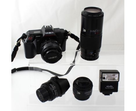 A Minolta 5000 35mm camera body with 35-70 zoom lens, a Sigma Superwide 2 lens, a Minolta 50mm lens, a 7210 Minolta zoom lens