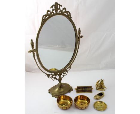 An oval ornamental dressing table mirror in filigree frame, a small brass sailing ship and ornamental Indian slipper, two Ind
