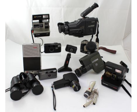 A collection of vintage home movie cameras, a Polaroid camera and Minolta Vectix S1 body etc.