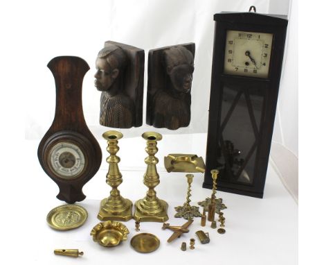 An early 20th century wall clock in oak case and an oak-cased aneroid barometer, a pair of African hardwood bookends and a se
