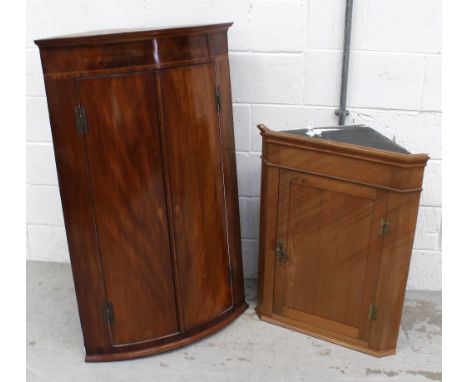 A George III mahogany bow-front corner cabinet with white painted interior, height 112.5cm and a smaller Victorian pine examp