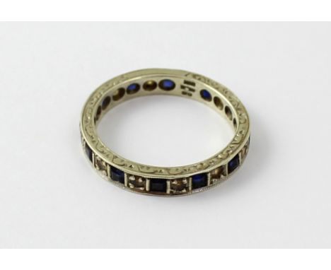 A 9ct white gold sapphire and diamond eternity ring, size O, approx 3g.