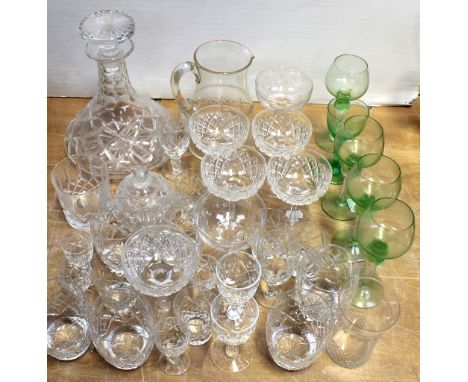 A quantity of cut glass and crystal, mainly drinking glasses to include Champagne bowls, wine glasses, tumblers, large decant