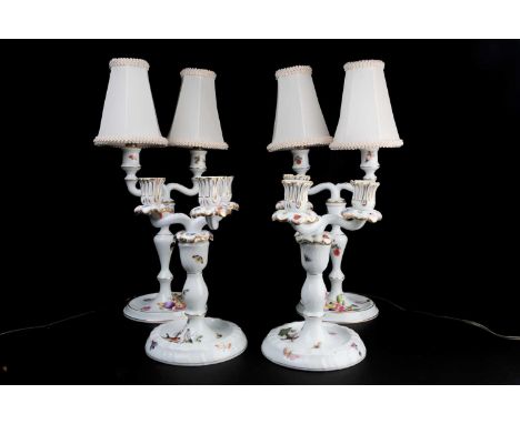 A pair of Herend porcelain three-sconce candlesticks, decorated with birds and insects, 22 cm high, together with a pair of H