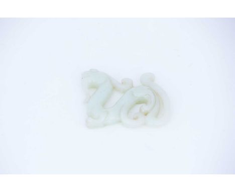 A Chinese carved jade archaic dragon, the stone a uniform colour throughout, 7cm long, 5.5cm highCondition report: No obvious