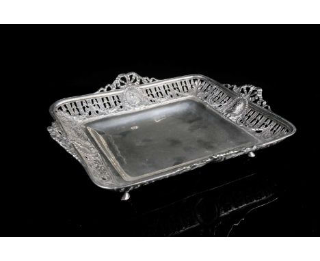 A 19th century Continental silver dish, bearing 1897 London import marks, of short rectangular form with ribbon-formed handle