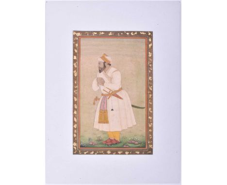 Indian School, 20th century, a full length portrait of a nobleman, with talwar and katar, resting against a cane, gouache, 31