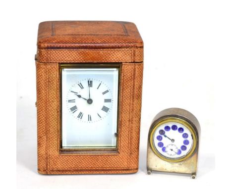 A brass Carriage timepiece with fitted travelling case and a miniature silver cased desk timepiece with a blue enamel numeral