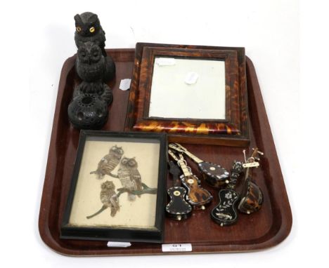 An 18th century Irish carved oak quill holder, two carved owl models, 19th century tortoiseshell framed mirror, a group of fi