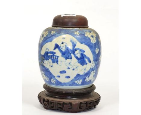 A Chinese porcelain cracked ice ginger jar, decorated with children playing, with a later wooden cover and on a hardwood stan